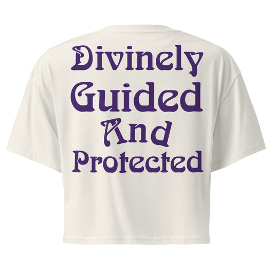 Balanced And At Peace – Divinely Guided And Protected Women's Crop Top in Ecru – back view with original spiritual mantra Divinely Guided And Protected by Jamilliah in purple | JAMILLIAH'S WISDOM IS TIMELESS SHOP