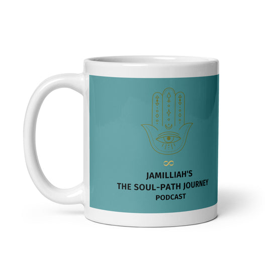JAMILLIAH'S THE SOUL-PATH JOURNEY PODCAST Mug in White – 11 oz handle-on-left view showing gold Hamsa hand with eye, gold infinity symbol, and podcast title on light teal background | JAMILLIAH'S WISDOM IS TIMELESS SHOP